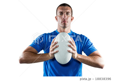 Portrait of confident sports player in blue jersey holding ball Portrait of confident sports player in blue jersey holding ball 18838396