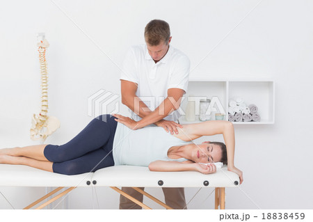 Doctor examining his patient pelvis Doctor examining his patient pelvis 18838459
