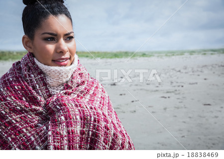Beautiful woman wrapped up in warm clothing 18838469