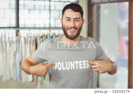 Man showing volunteer text on tshirt Man showing volunteer text on tshirt 18839274