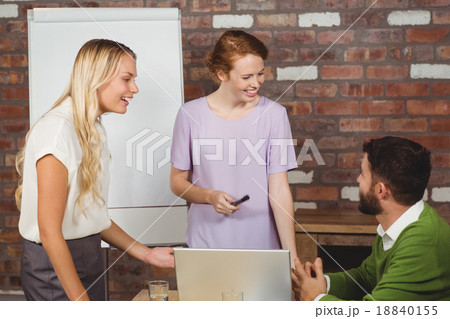 Business colleagues smiling during discussion Business colleagues smiling during discussion 18840155