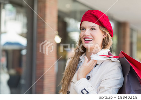 A smiling woman with shopping bags A smiling woman with shopping bags 18840218
