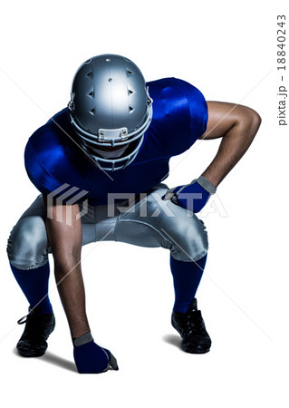American football player in uniform bending 18840243