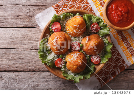 Arancini rice balls stuffed with meat and sauce 18842678
