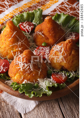 Arancini rice balls stuffed with meat and parmesan 18842685