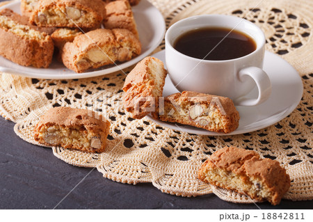 Black coffee and cookies with almonds close-up 18842811