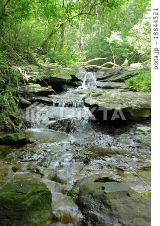 creek flowing over the rocks 18844521