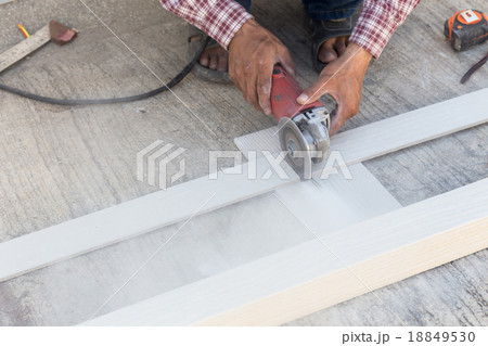 carpenter hands using electric saw on wood carpenter hands using electric saw on wood 18849530