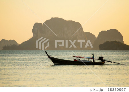 Longtail boat in the sea at the sunset 18850097