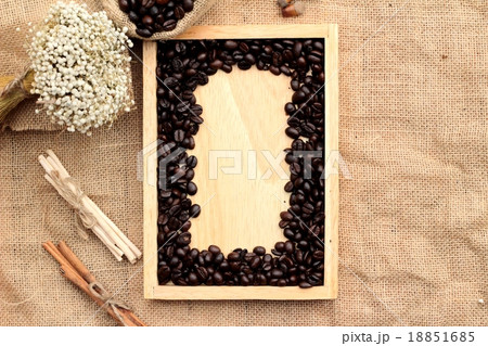 Roasted coffee beans on sack brown background. Roasted coffee beans on sack brown background. 18851685