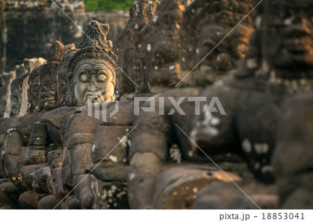 Stone carved statues of Asuras on the bridge Stone carved statues of Asuras on the bridge 18853041