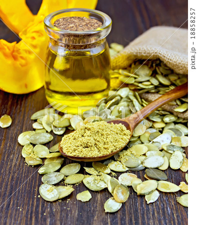 Flour pumpkin in spoon with oil and sacking 18858257