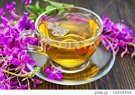 Tea from fireweed in glass cup on dark board 18858454