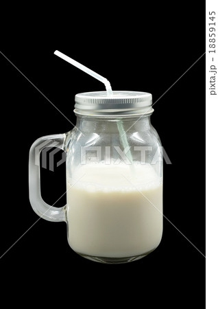 Milk in glass mug with metal lid Milk in glass mug with metal lid 18859145