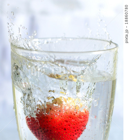 Strawberry splash in wine glass 18860780