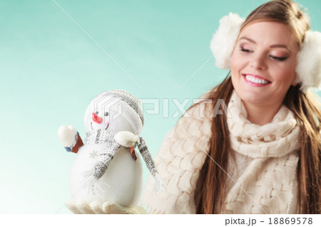 Smiling cute woman with little snowman. Winter. 18869578