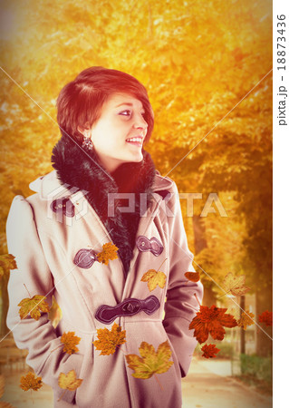 Composite image of smiling beautiful woman in winter coat 18873436