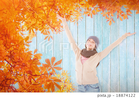 Composite image of smiling brunette standing arms open 18874122