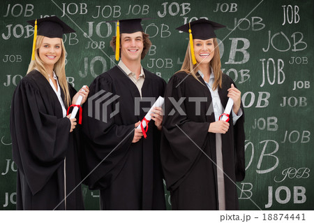 Composite image of three smiling students in graduate robe holdi 18874441