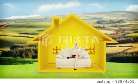 Composite image of cheering beautiful businesswoman sitting on c 18874559