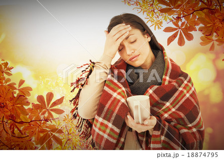 Composite image of sick woman having a migraine 18874795