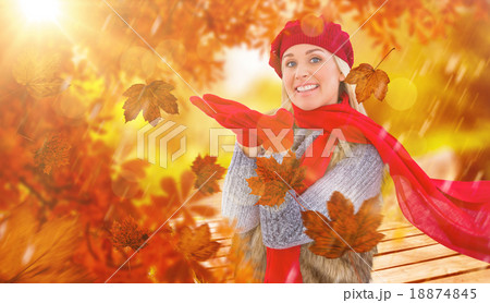 Composite image of blonde in winter clothes with hands out Composite image of blonde in winter clothes with hands out 18874845