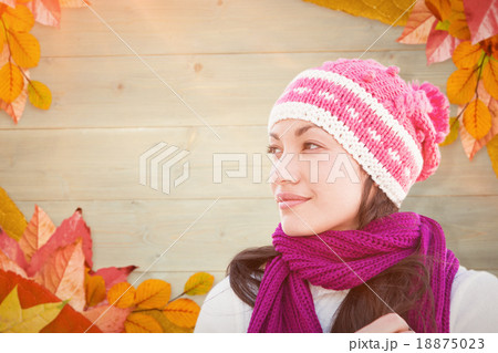 Composite image of pretty brunette in winter clothes 18875023