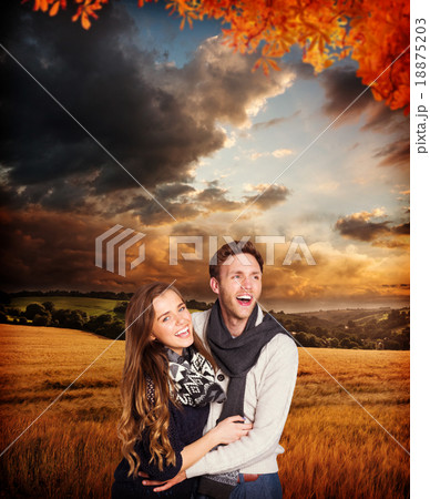 Composite image of happy young couple embracing 18875203