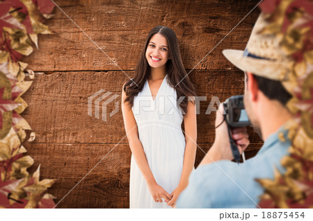 Composite image of hipster taking a photo of pretty girlfriend Composite image of hipster taking a photo of pretty girlfriend 18875454