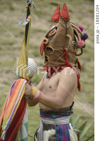 Man in mask celebrating solstice holiday.  18881204