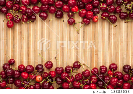 Cherry lying on bamboo mat Cherry lying on bamboo mat 18882658
