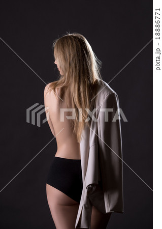 Back view of model with jacket over her shoulder 18886771