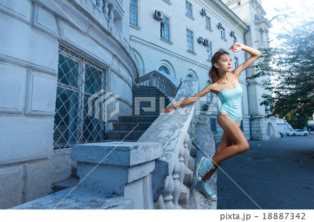 Beautiful girl in bodysuit posing with classical 18887342