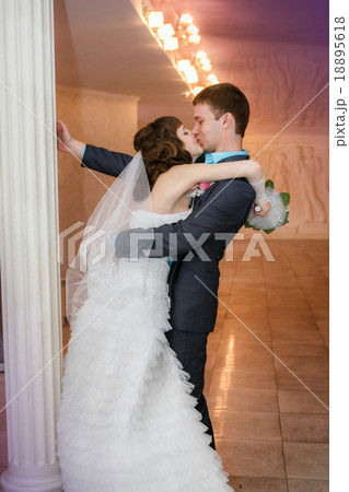 groom and the bride with a wedding bouquet  18895618