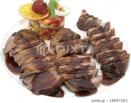goose breast with vegetables on a white plate goose breast with vegetables on a white plate 18897361