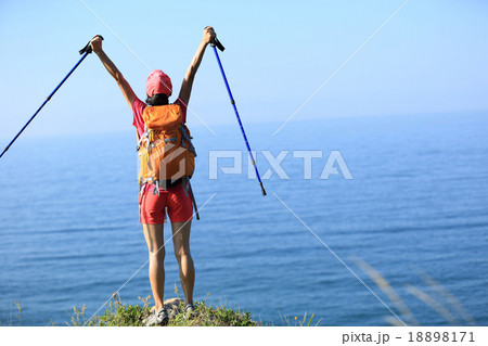 cheering young woman hiker open arms  18898171