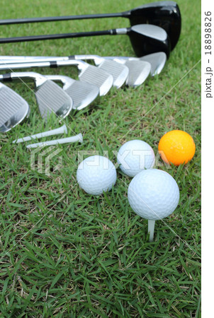 Golf ball and golf club in bag on green grass Golf ball and golf club in bag on green grass 18898826