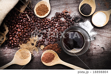 grated coffee in spoon on roasted coffee grated coffee in spoon on roasted coffee 18898864