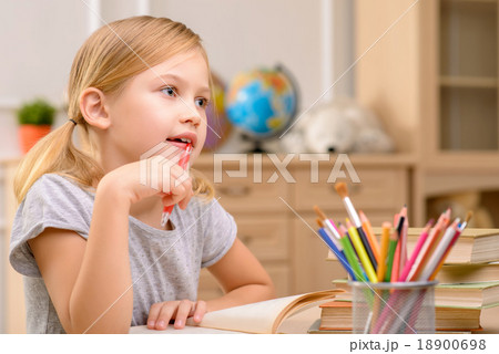 Pretty girls sitting at the table  18900698