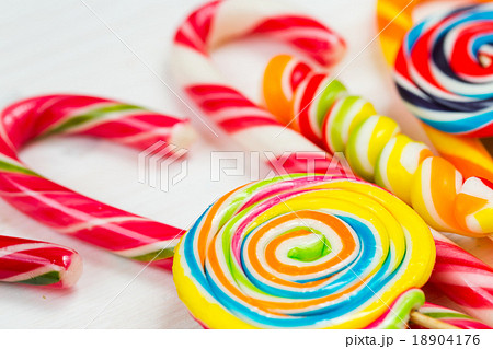 Colorful candy on a white wooden background 18904176