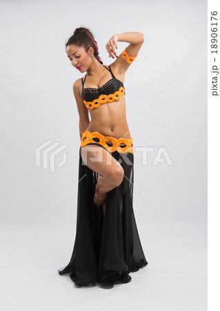 Young girl mulatto dancing in a long black dress candid Young girl mulatto dancing in a long black dress candid 18906176