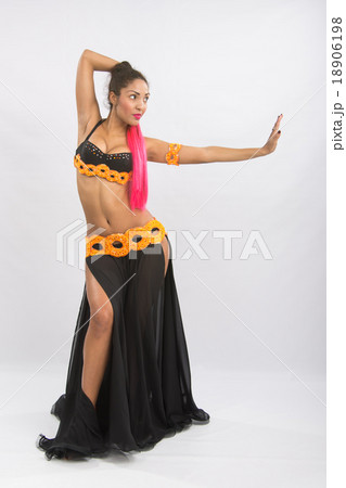 Young girl mulatto dancing in a long black dress candid Young girl mulatto dancing in a long black dress candid 18906198