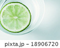 slices of lime in a glass of mineral water 18906720