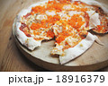 Homemade pizza on wooden table 18916379