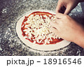 Woman making pizza on table 18916546