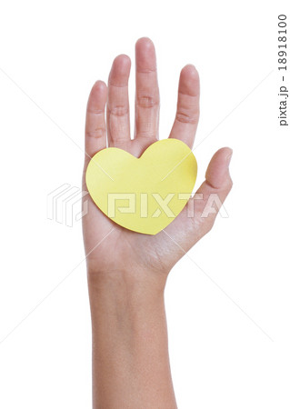 A female hand holding paper heart 18918100