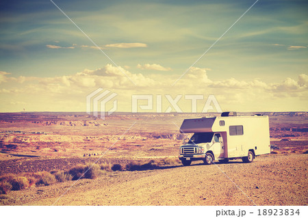 Retro toned camper parked by canyon. 18923834