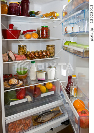 Domestic refrigerator full of a variety of foods Domestic refrigerator full of a variety of foods 18928013