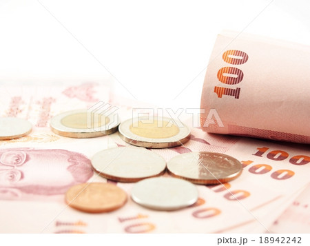 Rolled banknotes on pile of money Rolled banknotes on pile of money 18942242