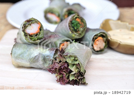 Vegetable salad wrapped into spring rolls Vegetable salad wrapped into spring rolls 18942719